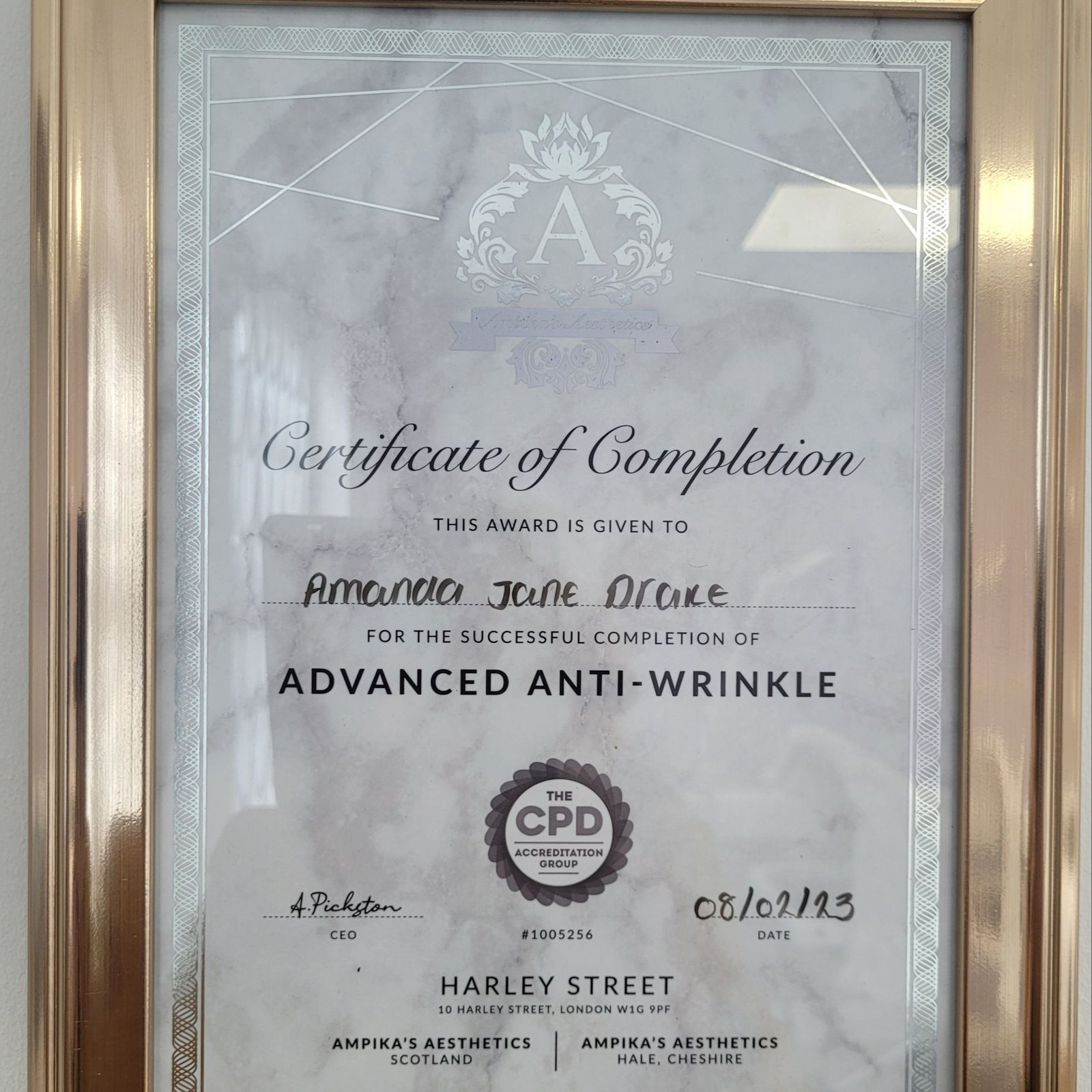 A framed training certificate on the clinic wall
