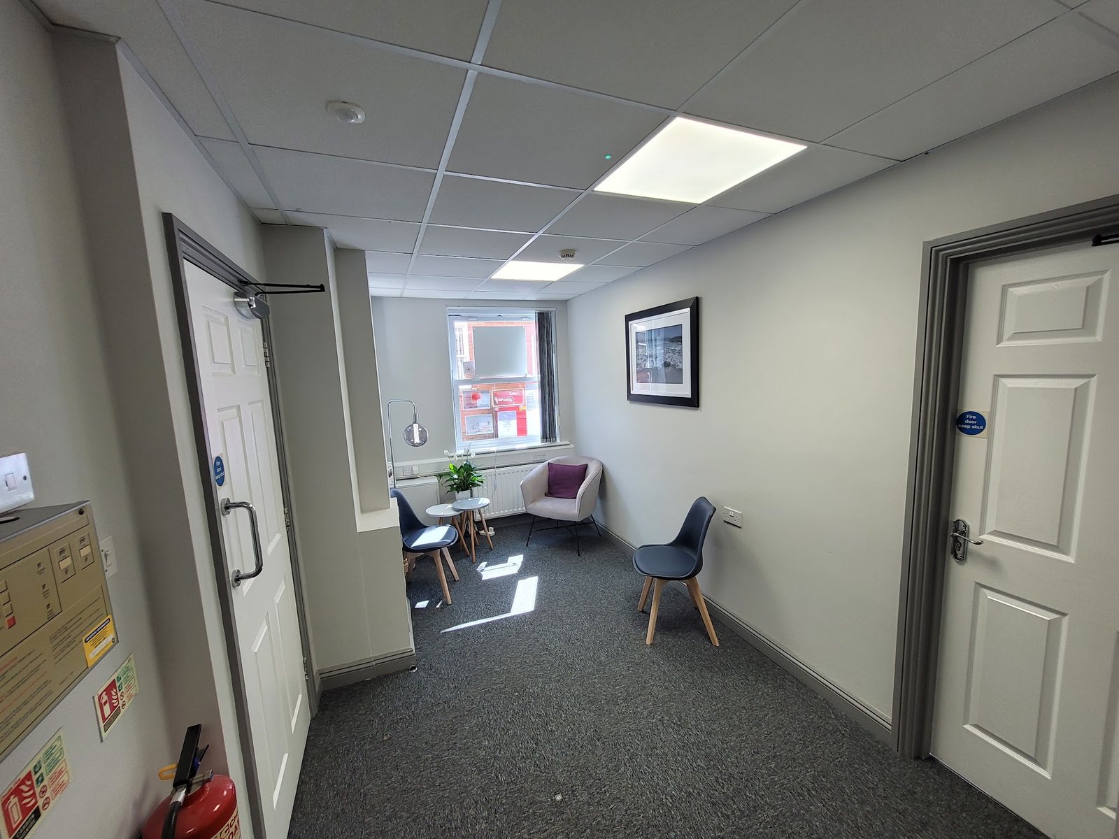 The corridor and waiting area outside the treatment room